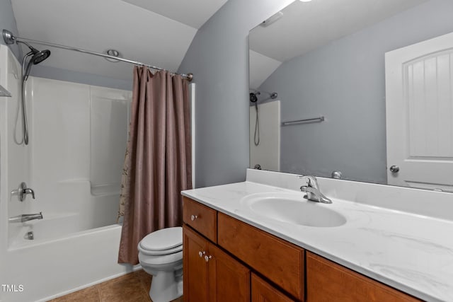 39 Mcguire Ln, Clayton, NC 27527 - bathroom with toilet, vanity, shower / bath combo, tile patterned floors, and vaulted ceiling