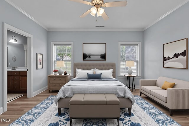 39 Mcguire Ln, Clayton, NC 27527 - bedroom featuring wood finished floors, baseboards, crown molding, ensuite bath, and a ceiling fan