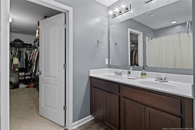 1324 Homeland Dr, Parkton, NC 28371 - bathroom featuring double vanity and a spacious closet