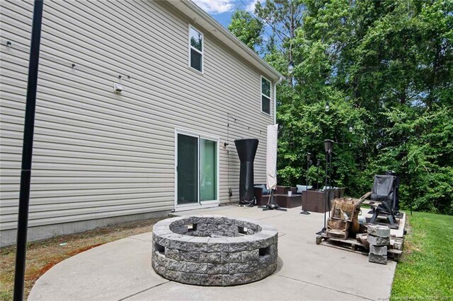 1324 Homeland Dr, Parkton, NC 28371 - view of patio / terrace featuring an outdoor living space with a fire pit
