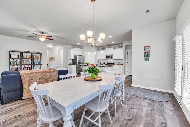 1096 Aberlour Ln, Burlington, NC 27215 - dining room featuring a chandelier, ceiling fan, dark wood-type flooring, baseboards, and recessed lighting