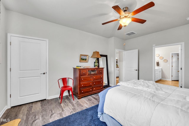 1096 Aberlour Ln, Burlington, NC 27215 - bedroom with baseboards, wood finished floors, ceiling fan, and ensuite bathroom