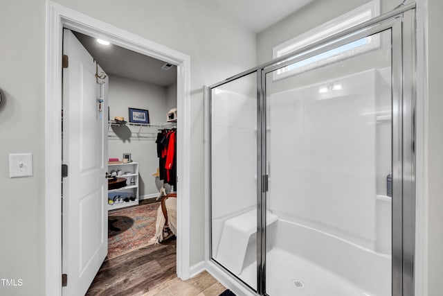 1096 Aberlour Ln, Burlington, NC 27215 - full bath with a stall shower, wood finished floors, a spacious closet, and baseboards