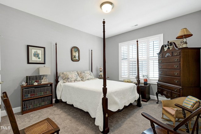 bedroom featuring carpet flooring and baseboards