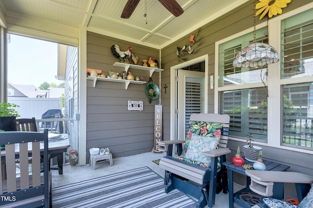 view of patio featuring covered porch and a ceiling fan