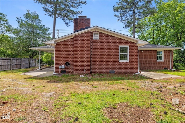 5345 Lamm Rd, Wilson, NC 27893 - rear view of house with a patio area, a chimney, brick siding, and crawl space