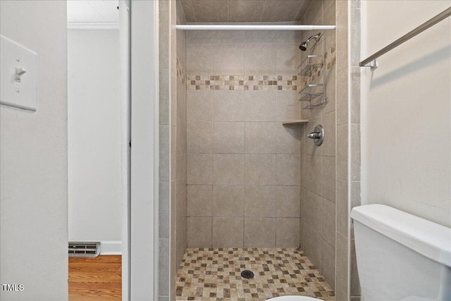 5345 Lamm Rd, Wilson, NC 27893 - bathroom with a shower stall, toilet, and wood finished floors