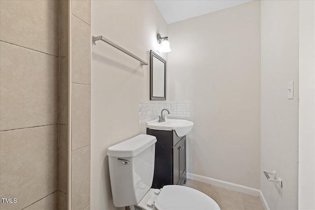 5345 Lamm Rd, Wilson, NC 27893 - bathroom with toilet, vanity, tile patterned floors, and backsplash