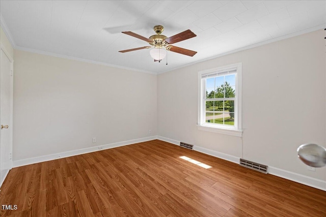 5345 Lamm Rd, Wilson, NC 27893 - unfurnished room featuring ornamental molding, wood finished floors, ceiling fan, and baseboards