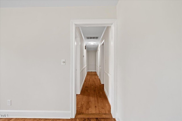 5345 Lamm Rd, Wilson, NC 27893 - corridor with wood finished floors, baseboards, and attic access