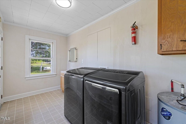 5345 Lamm Rd, Wilson, NC 27893 - laundry area with water heater, washing machine and clothes dryer, crown molding, cabinet space, and light tile patterned flooring