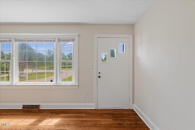5345 Lamm Rd, Wilson, NC 27893 - entrance foyer with wood finished floors, baseboards, and healthy amount of natural light