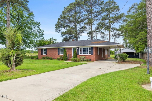 5345 Lamm Rd, Wilson, NC 27893 - ranch-style house featuring concrete driveway, brick siding, and an attached carport