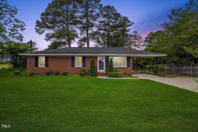 5345 Lamm Rd, Wilson, NC 27893 - ranch-style house with driveway, a carport, brick siding, and crawl space