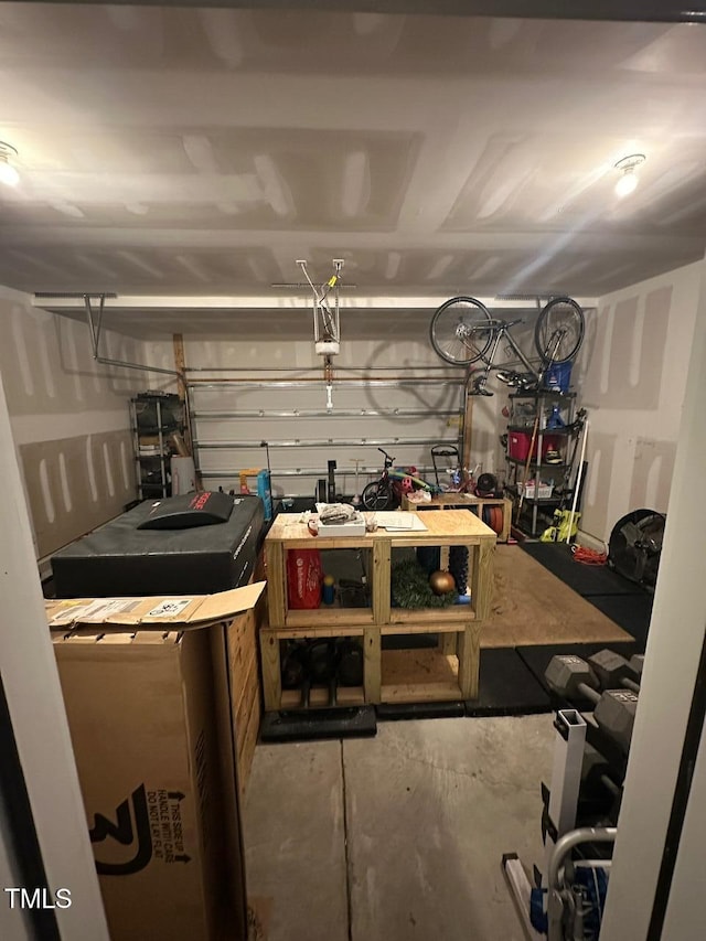 99 Still Hand Dr, Clayton, NC 27527 - garage featuring a workshop area and a garage door opener