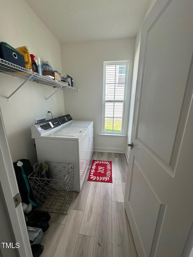99 Still Hand Dr, Clayton, NC 27527 - laundry room with separate washer and dryer and wood finished floors