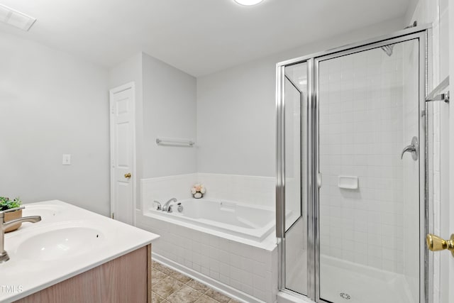 8610 Neuse Landing Ln Unit 103, Raleigh, NC 27616 - full bathroom with a sink, a garden tub, a shower stall, and tile patterned flooring