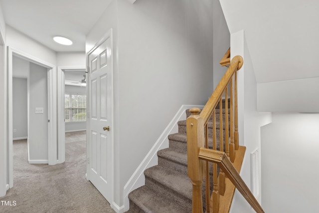 8610 Neuse Landing Ln Unit 103, Raleigh, NC 27616 - staircase with carpet flooring, baseboards, and a ceiling fan