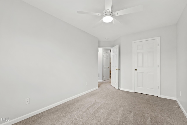 8610 Neuse Landing Ln Unit 103, Raleigh, NC 27616 - unfurnished bedroom with carpet, baseboards, and a ceiling fan