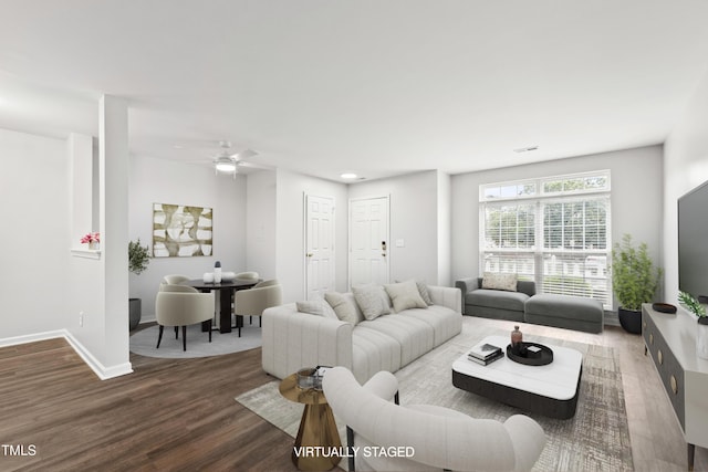8610 Neuse Landing Ln Unit 103, Raleigh, NC 27616 - living room featuring dark wood-style floors, a ceiling fan, and baseboards