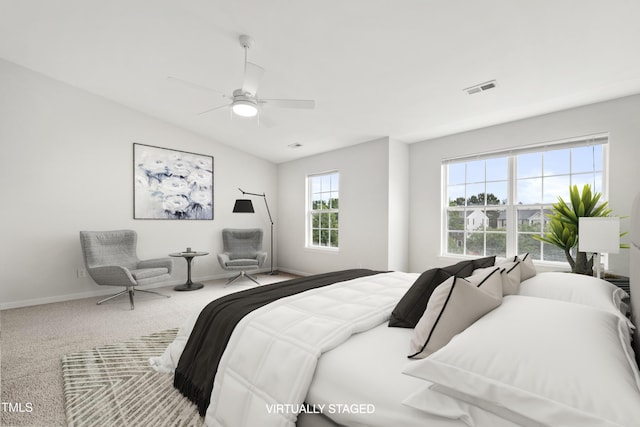 8610 Neuse Landing Ln Unit 103, Raleigh, NC 27616 - carpeted bedroom featuring baseboards, vaulted ceiling, and a ceiling fan