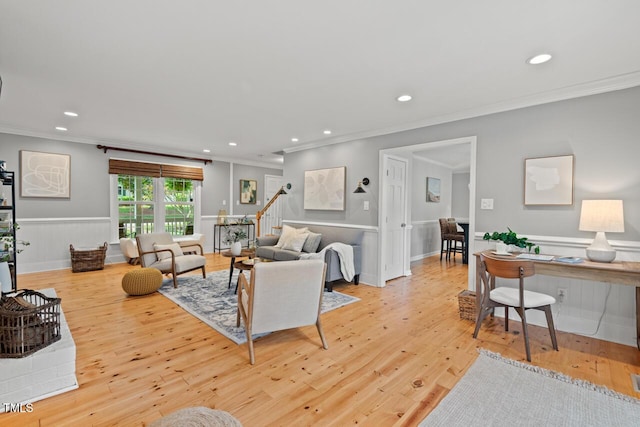 6304 Ansley Ln, Raleigh, NC 27612 - living room with crown molding, recessed lighting, light wood finished floors, a wainscoted wall, and stairs