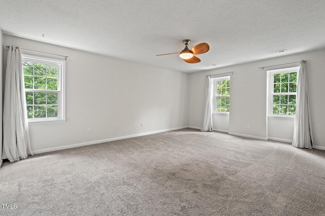 6304 Ansley Ln, Raleigh, NC 27612 - carpeted spare room with ceiling fan, a textured ceiling, and baseboards