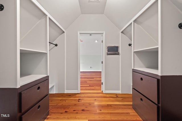 6304 Ansley Ln, Raleigh, NC 27612 - walk in closet featuring light wood finished floors and vaulted ceiling