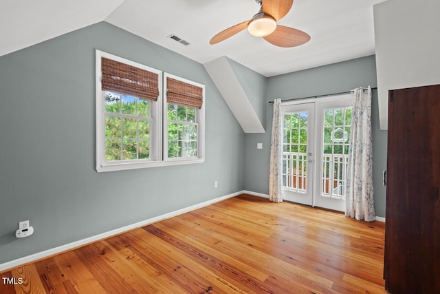 6304 Ansley Ln, Raleigh, NC 27612 - additional living space with vaulted ceiling, a ceiling fan, french doors, wood finished floors, and baseboards