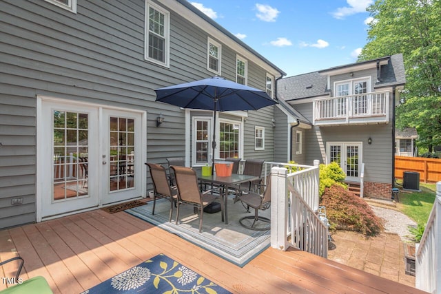 6304 Ansley Ln, Raleigh, NC 27612 - wooden terrace with french doors, outdoor dining area, and central AC