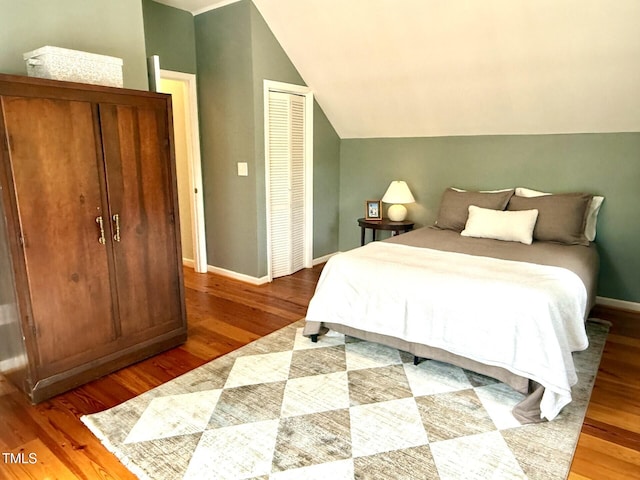 6304 Ansley Ln, Raleigh, NC 27612 - bedroom with wood finished floors and lofted ceiling