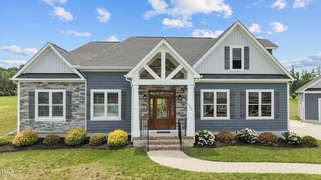 4564 Ashtons Way, Franklinton, NC 27525 - view of front of home with board and batten siding, stone siding, and a front yard