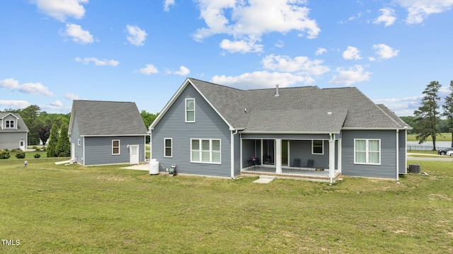 4564 Ashtons Way, Franklinton, NC 27525 - rear view of house featuring a patio, a yard, a shingled roof, and cooling unit