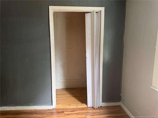corridor with wood finished floors