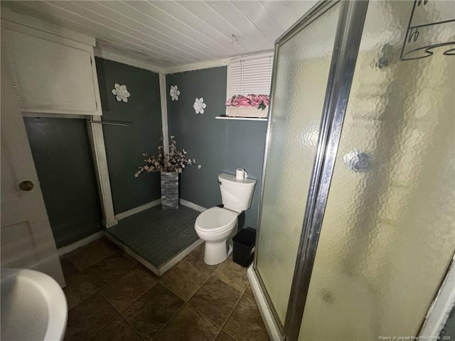 full bath with a stall shower and toilet