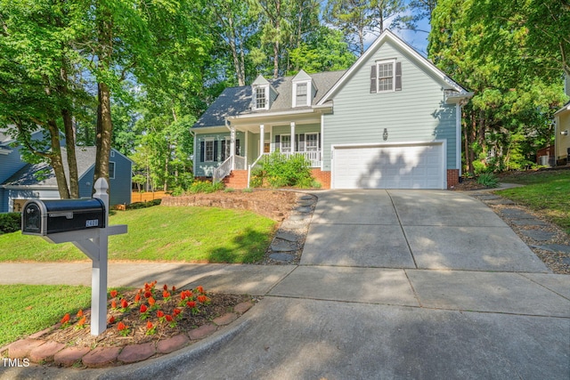 2408 Fordcrest Dr, Apex, NC 27502 - view of front facade with covered porch, an attached garage, a front yard, and driveway