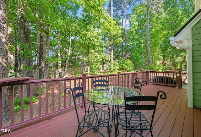 2408 Fordcrest Dr, Apex, NC 27502 - deck featuring outdoor dining area and view of wooded area