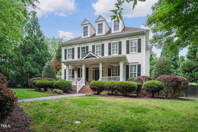 3325 Falls River Ave, Raleigh, NC 27614 - view of front facade featuring covered porch and a front lawn