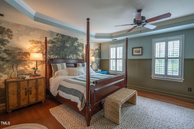 3325 Falls River Ave, Raleigh, NC 27614 - bedroom with crown molding, wood finished floors, a raised ceiling, a ceiling fan, and baseboards