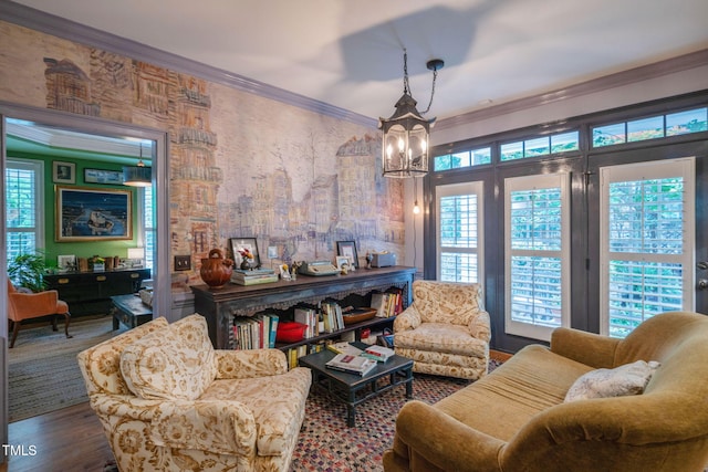 3325 Falls River Ave, Raleigh, NC 27614 - living area with healthy amount of natural light, a chandelier, crown molding, and wood finished floors