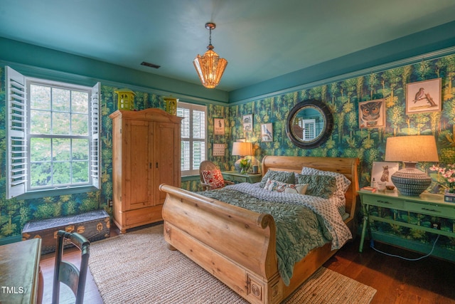 3325 Falls River Ave, Raleigh, NC 27614 - bedroom featuring wood finished floors and wallpapered walls