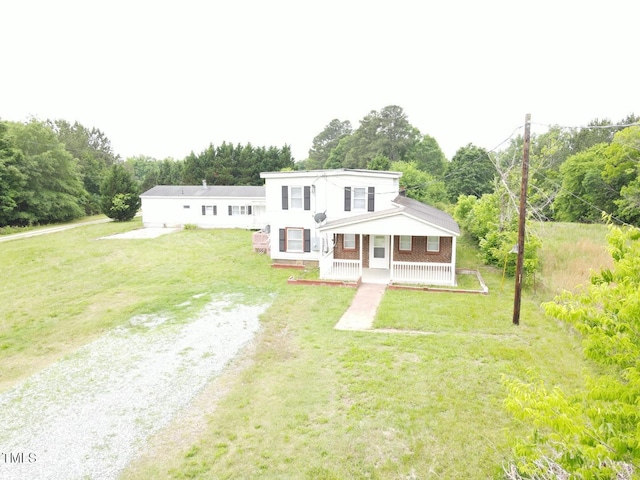 3354 Altamahaw Church St, Elon, NC 27244 - view of front of property featuring driveway, covered porch, a front lawn, and view of scattered trees