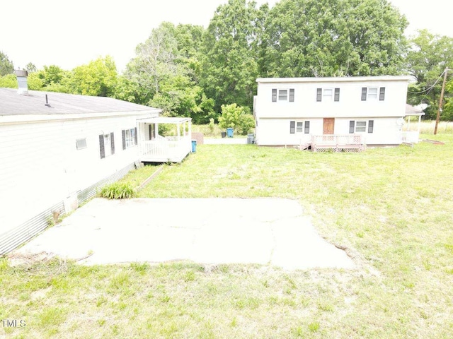 3354 Altamahaw Church St, Elon, NC 27244 - view of green lawn with a wooden deck and view of wooded area