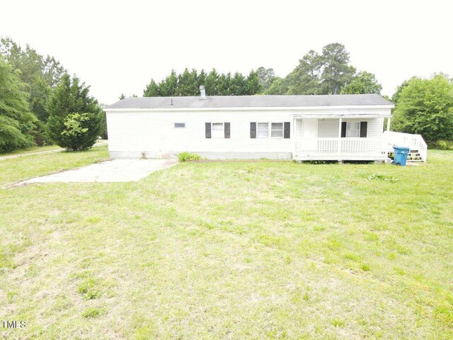 3354 Altamahaw Church St, Elon, NC 27244 - rear view of property featuring a yard and a deck