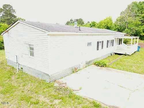 3354 Altamahaw Church St, Elon, NC 27244 - view of property exterior with a patio area and a yard