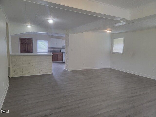 3354 Altamahaw Church St, Elon, NC 27244 - unfurnished living room with dark wood-style floors and baseboards