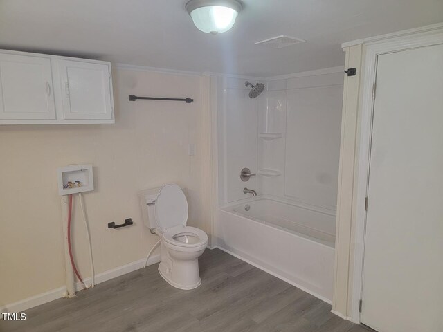 3354 Altamahaw Church St, Elon, NC 27244 - bathroom featuring wood finished floors, toilet, shower / tub combination, and baseboards
