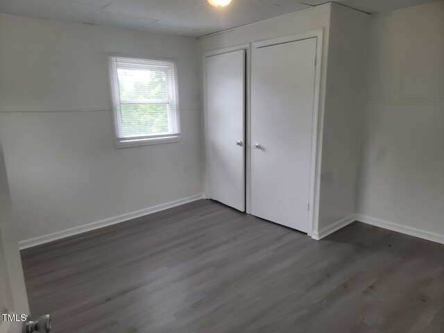 3354 Altamahaw Church St, Elon, NC 27244 - unfurnished bedroom with dark wood finished floors and baseboards
