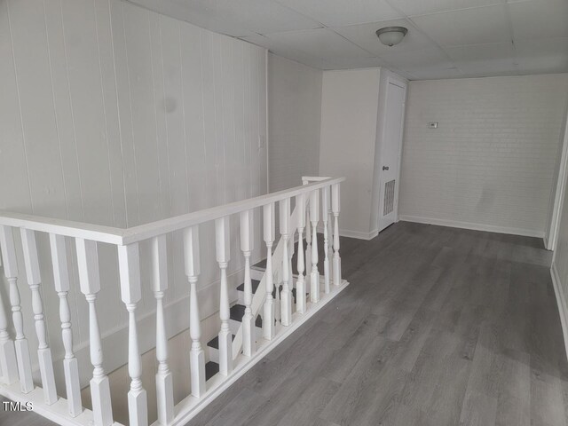 3354 Altamahaw Church St, Elon, NC 27244 - corridor featuring wood finished floors, baseboards, an upstairs landing, and a paneled ceiling