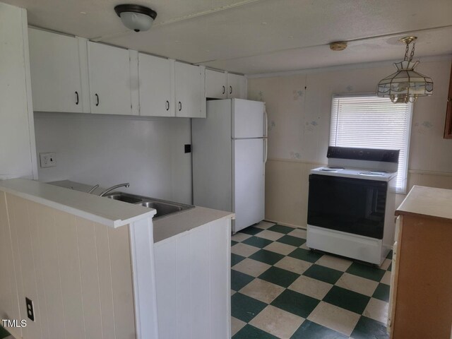 3354 Altamahaw Church St, Elon, NC 27244 - kitchen with white appliances, light floors, a sink, a peninsula, and white cabinets